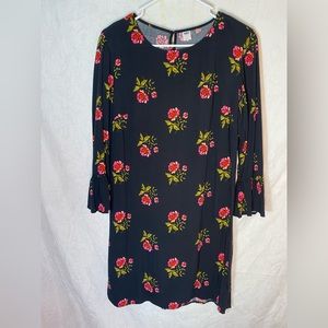 Black dress with floral details.